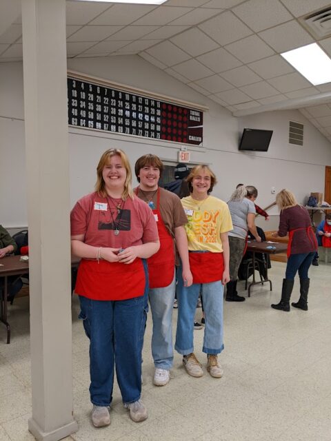 Jaiden, Kyle, and Miles volunteering